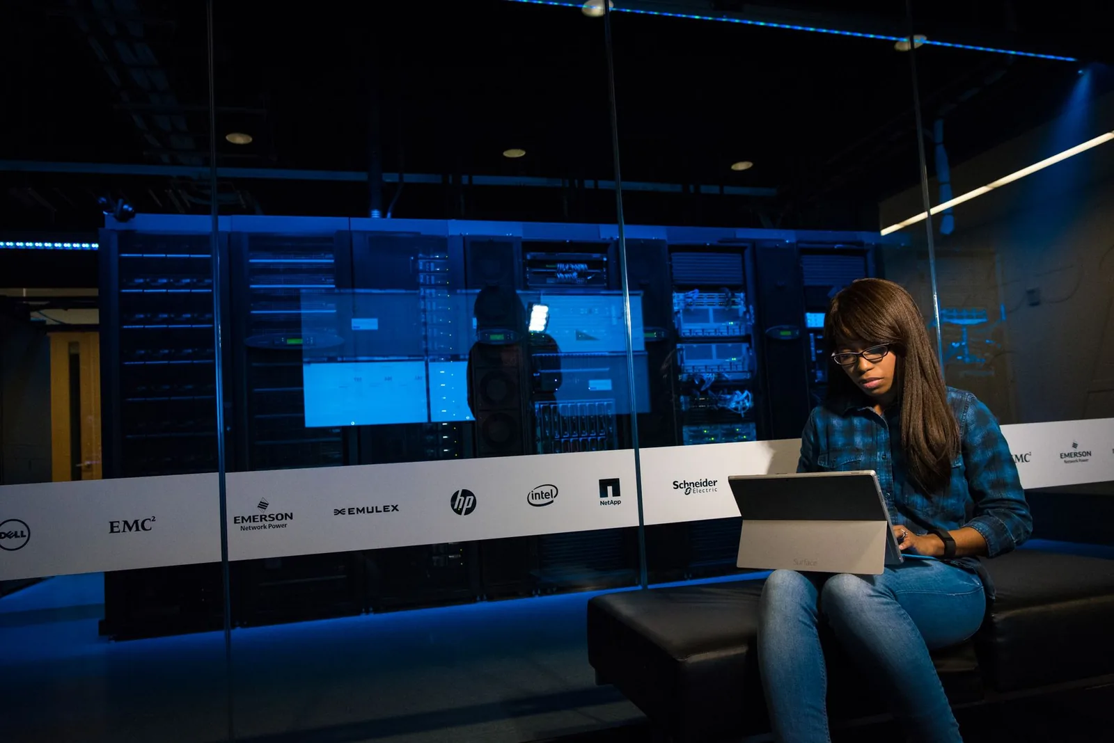 Developer working on AI agent architecture with terminal and server infrastructure in background