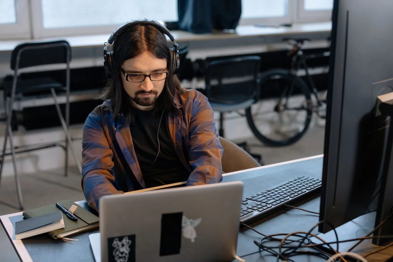 Small business operations team reviewing automated workflows on a laptop in a modern office