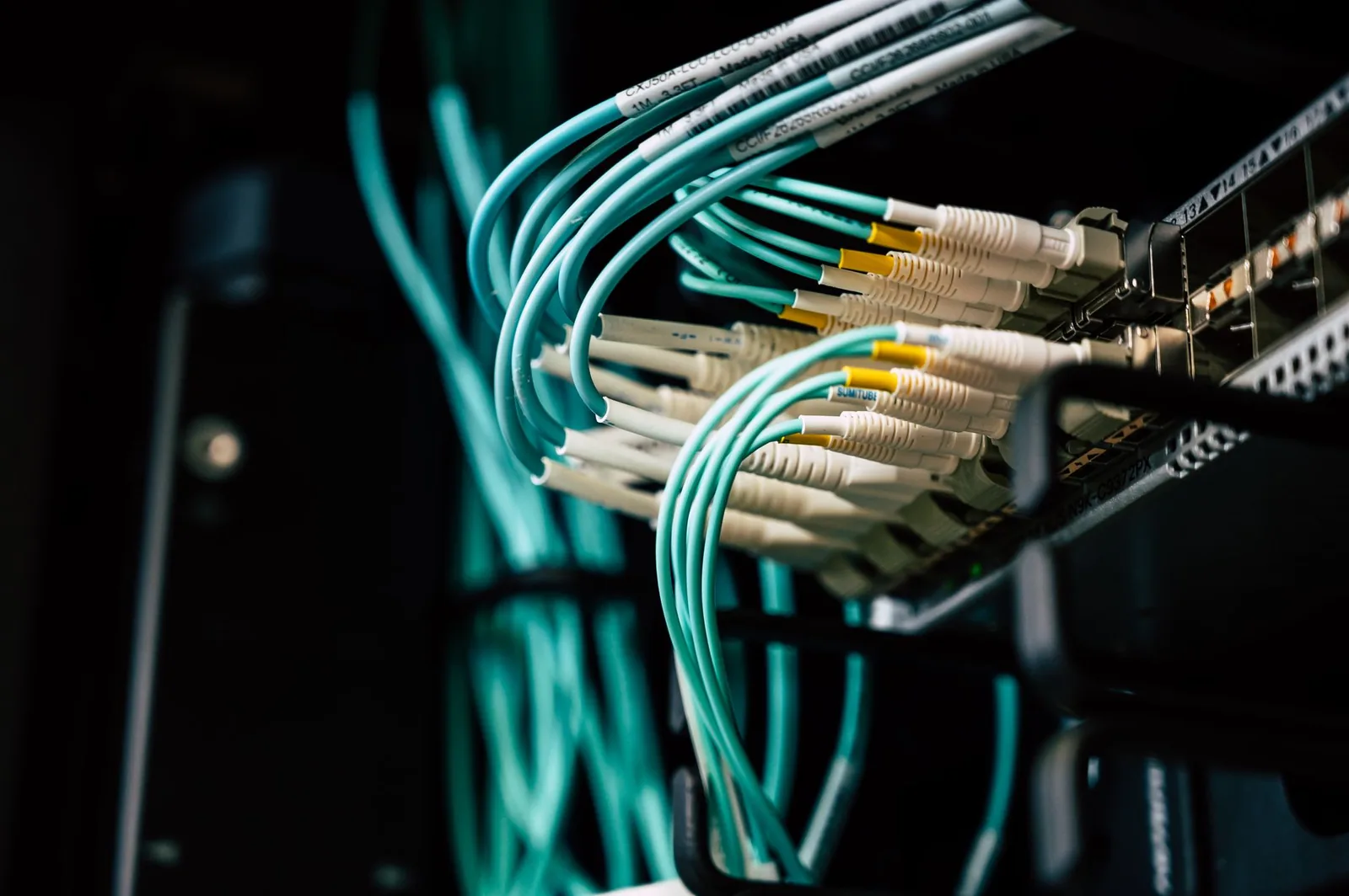 Data center server racks with network cables representing MCP server production infrastructure and authentication